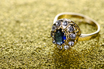 Jewellery ring against shiny background