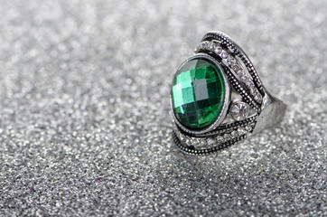 Jewellery ring against shiny background