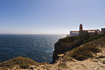 Fototapeta na wymiar lighthouse on top of cliff at Cabo Sao Vicente, Algarve region,