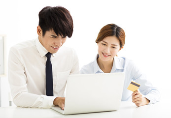 young business man and woman  buying online with credit card