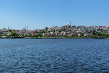 Obraz premium distant shore of Istanbul with hills and houses. with sea view.