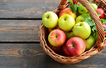 3 Different kinds of apples and the tasty benefits of each.
colorful and various kinds of apples in the basket on wooden background.