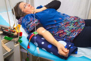 Intravenous infusion therapy on mature woman