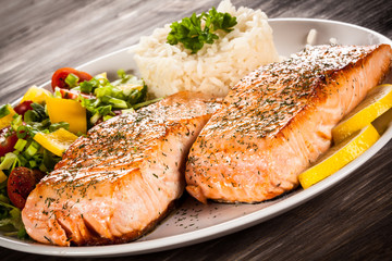Fried salmon, boiled rice and vegetables