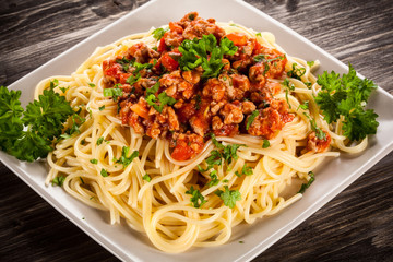 Spaghetti with meat, tomato sauce and vegetables 