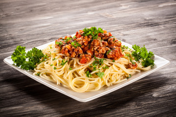 Spaghetti with meat, tomato sauce and vegetables 