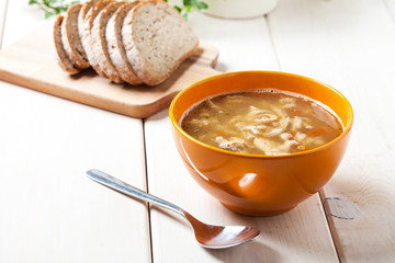 Traditional polish tripe soup with vegetables.