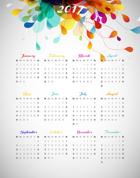 2017 calendar with abstract background with colorful leafs.
