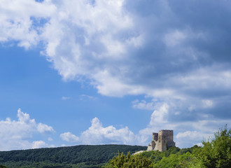 Landscape Image, Ruins of a castle in Csesznek, Veszprem, Hungary with Blue Sky and Clouds