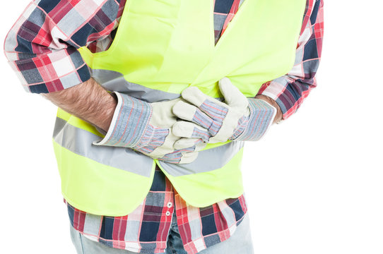 Closeup of constructor having a stomach ache