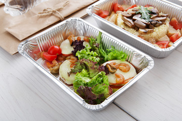 Healthy food in boxes, diet concept.