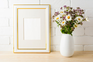 Frame mockup with wild flowers bouquet