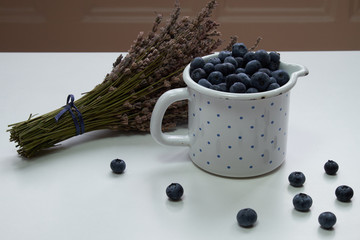 Blueberries in pot with dry lavender