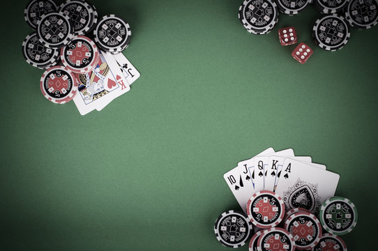 Top View Of Green Casino Table With Royal Flush, Red And Black C