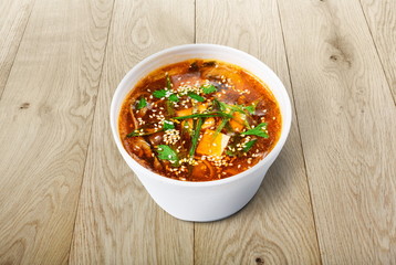 Hot food delivery - miso soup at wood