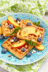 Plate of belgian waffles with fresh berries