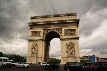 Fototapeta na wymiar Cars Around the Arc de Triomphe in Paris, France