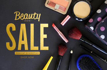 cover design makeup cosmetics and brushes on black background, over light