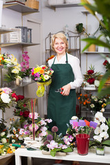 Female florist at the work .