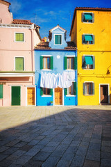 Hung laundry on the lines in front of houses in Burano.