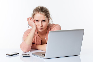 unhappy young blond woman complaining about studying or working