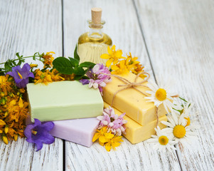 Obraz na płótnie Canvas herbal treatment - camomile, tutsan and soap