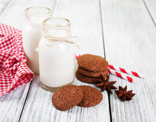 oatmeal cookies and bottles of milk