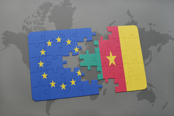 puzzle with the national flag of european union and cameroon on a world map background.