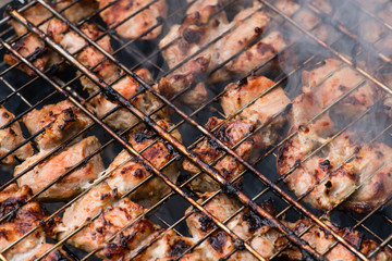 texture Closeup of meat fried on a grill with smoke