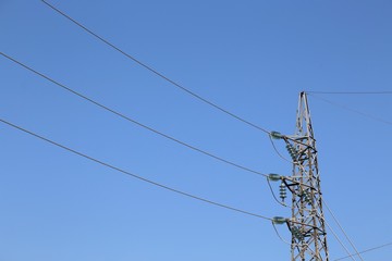 high galvanized iron trellis with high-voltage electrical cables