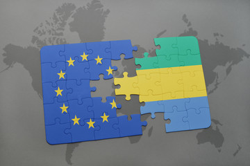 puzzle with the national flag of european union and gabon on a world map background.