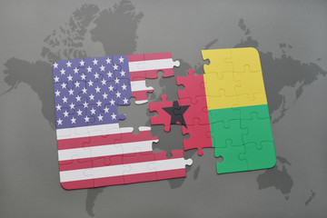 puzzle with the national flag of united states of america and guinea bissau on a world map background.