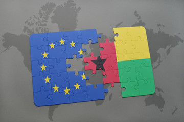 puzzle with the national flag of european union and guinea bissau on a world map background.