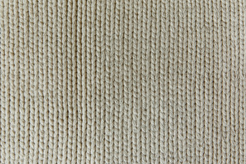The Knitting Background with White Stitch.Handmade Texture.Pattern