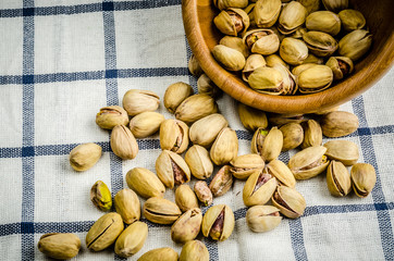roasted and salted pistachios on table cloth