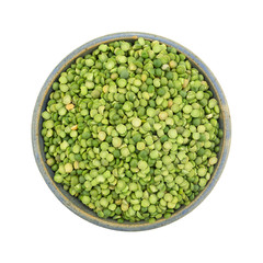 Bowl of organic green split peas on white a background.