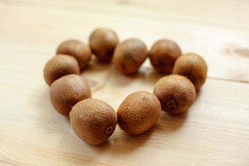 Fresh Kiwi Fruits on an old wooden table