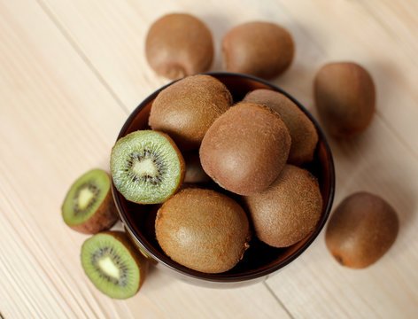 Fresh Kiwi Fruits on an old wooden table