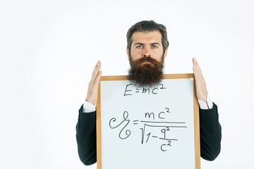 bearded man with einstein formula and newtons law