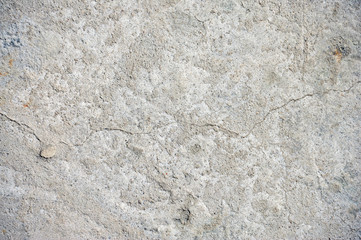 Gray cracked concrete texture background, close up