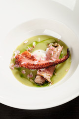 Fine dining seafood appetizer with grilled octopus