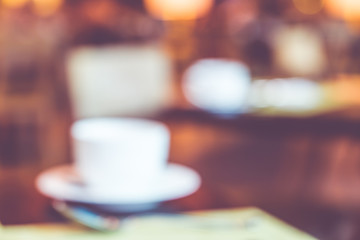 Blurred background,coffee cup on table with bokeh light
