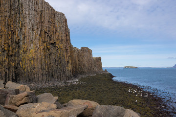 Basalt rock formations with sea, South Iceland