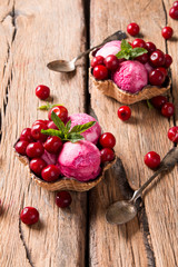 Fototapeta na wymiar Ice Cream sour cherry, summer sundae with fresh fruits on wooden background. 