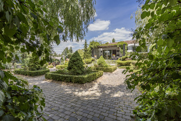 Modern country house with vast cobbled backyard