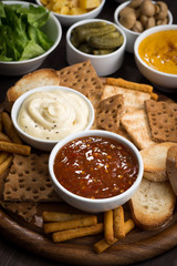 assortment delicious appetizers with different sauces, vertical