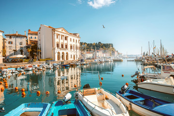 View on marina with boats and buoys in Piran town in southwestern Slovenia - obrazy, fototapety, plakaty