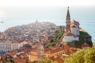 Obraz premium Aerial city scape view on Piran town with church tower and Adriatic sea on the background in Slovenia