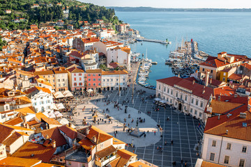 Beautiful aerial view on Piran town with Tartini main square, ancient buildings with red roofs and Adriatic sea in southwestern Slovenia - obrazy, fototapety, plakaty