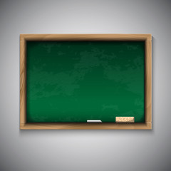 Realistic blackboard on wooden background